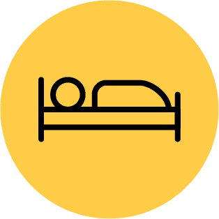 Icon of a person sleeping in a bed, symbolising the benefits of solar panels for hospitality and leisure businesses.